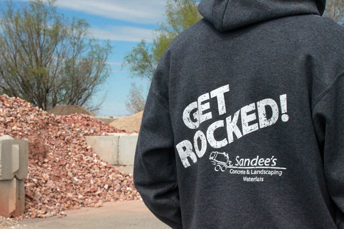 Man Wearing a Sandees Sweatshirt With Get Rocked Slogan on Back