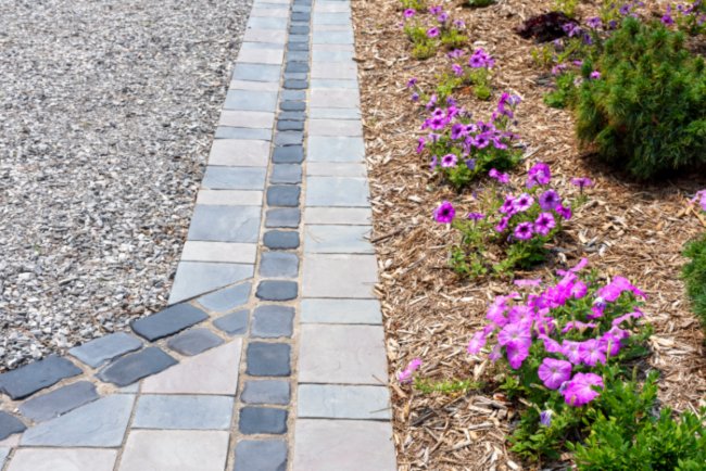Landscaping and hardscaping with pavers, gravel & flowers by Sandee’s Soil and Rock in Utah